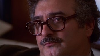 Movie still from “Soul Food” (1997), directed by George Tillman Jr. – A person wearing glasses and a mustache; Close Up shot, Low angle