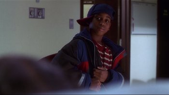 Movie still from “Soul Food” (1997), directed by George Tillman Jr. – A young boy wearing a hat and a jacket; Close Up shot, Low angle