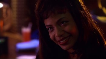 Movie still from “Soul Food” (1997), directed by George Tillman Jr. – A person smiling at the camera; Close Up shot, Over the shoulder angle