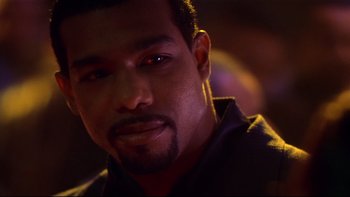 Movie still from “Soul Food” (1997), directed by George Tillman Jr. – A man's face in the dark; Close Up shot, Over the shoulder angle