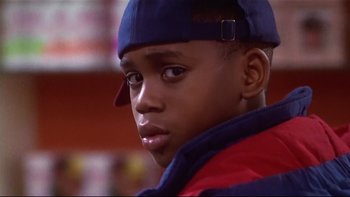 Movie still from “Soul Food” (1997), directed by George Tillman Jr. – A person wearing a hat; Close Up shot, Low angle