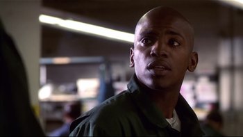 Movie still from “Soul Food” (1997), directed by George Tillman Jr. – A person wearing a green jacket; Close Up shot, Low angle
