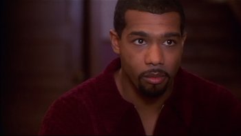 Movie still from “Soul Food” (1997), directed by George Tillman Jr. – A person wearing a red shirt; Close Up shot, High angle