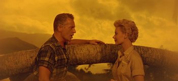Movie still from “South Pacific” (1958), directed by Joshua Logan – An older man and a younger woman face each other; Medium shot, Low angle