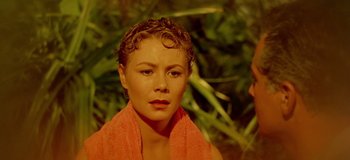 Movie still from “South Pacific” (1958), directed by Joshua Logan – A person with a towel around her neck; Close Up shot, High angle