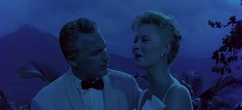 Movie still from “South Pacific” (1958), directed by Joshua Logan – A man and a woman standing next to each other; Medium shot, Low angle