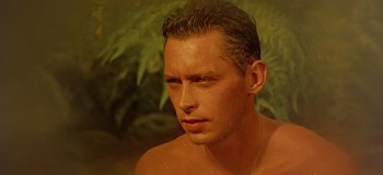 Movie still from “South Pacific” (1958), directed by Joshua Logan – A person wearing a necklace; Close Up shot, Low angle