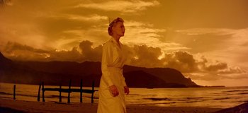 Movie still from “South Pacific” (1958), directed by Joshua Logan – A woman standing on the beach in front of the ocean; Wide shot, Low angle