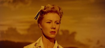 Movie still from “South Pacific” (1958), directed by Joshua Logan – A woman with a bow in her hair; Close Up shot, Low angle
