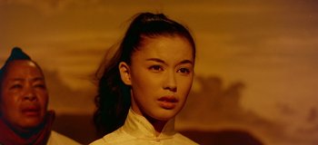Movie still from “South Pacific” (1958), directed by Joshua Logan – A young woman with long dark hair wearing a cheongsam; Close Up shot, Low angle