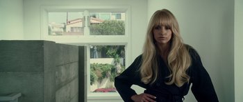 Movie still from “Southland Tales” (2006), directed by Richard Kelly – A woman standing in front of an open window; Close Up shot, Low angle