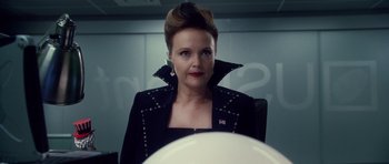 Movie still from “Southland Tales” (2006), directed by Richard Kelly – A woman in a black jacket and a red lipstick; Close Up shot, Over the shoulder angle
