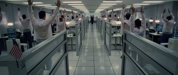 Movie still from “Southland Tales” (2006), directed by Richard Kelly – A group of people standing in an office building; Extreme Wide shot, High angle