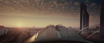 Movie still from “Southland Tales” (2006), directed by Richard Kelly – An aerial view of a building with a sky background; Extreme Wide shot, Low angle