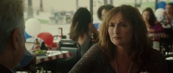 Movie still from “Southland Tales” (2006), directed by Richard Kelly – A person sitting at a table in a restaurant; Close Up shot, Over the shoulder angle