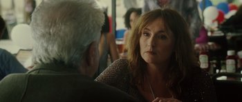 Movie still from “Southland Tales” (2006), directed by Richard Kelly – A woman sitting next to a man in a restaurant; Close Up shot, Over the shoulder angle