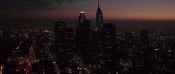 Movie still from “Southland Tales” (2006), directed by Richard Kelly – A view of a city skyline at night with the lights on; Extreme Wide shot, High angle
