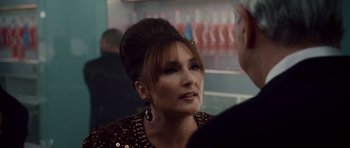 Movie still from “Southland Tales” (2006), directed by Richard Kelly – A person wearing a dress and talking to another person; Close Up shot, Over the shoulder angle