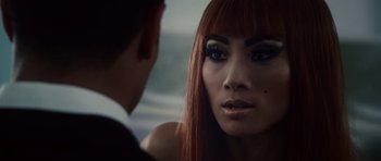 Movie still from “Southland Tales” (2006), directed by Richard Kelly – A person with long red hair; Close Up shot, Over the shoulder angle