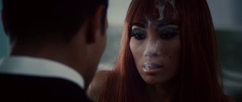Movie still from “Southland Tales” (2006), directed by Richard Kelly – A woman smoking a cigarette in front of a man; Close Up shot, Over the shoulder angle