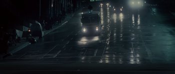 Movie still from “Southland Tales” (2006), directed by Richard Kelly – A city bus driving down a wet street at night; Extreme Wide shot, Low angle