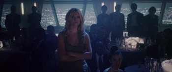 Movie still from “Southland Tales” (2006), directed by Richard Kelly – A group of people sitting in a dark room; Medium shot, Low angle