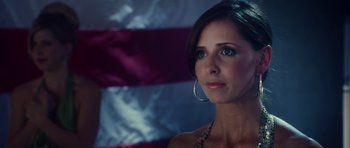 Movie still from “Southland Tales” (2006), directed by Richard Kelly – A beautiful woman with blue eyes looking at the camera; Close Up shot, Over the shoulder angle