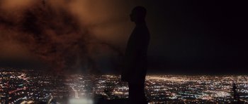 Movie still from “Southland Tales” (2006), directed by Richard Kelly – A man standing on top of a hill at night; Extreme Wide shot, Low angle