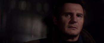 Movie still from “A Walk Among the Tombstones” (2014), directed by Scott Frank – A person looking at the camera; Close Up shot, Low angle