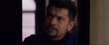 Movie still from “A Walk Among the Tombstones” (2014), directed by Scott Frank – A person with a beard; Close Up shot, Over the shoulder angle