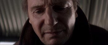 Movie still from “A Walk Among the Tombstones” (2014), directed by Scott Frank – An older man with a sad look on his face; Close Up shot, Low angle