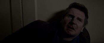 Movie still from “A Walk Among the Tombstones” (2014), directed by Scott Frank – A man with blood all over his face; Close Up shot, Low angle