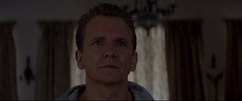 Movie still from “A Walk Among the Tombstones” (2014), directed by Scott Frank – A person looking at the camera; Close Up shot, Over the shoulder angle