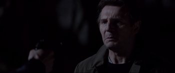 Movie still from “A Walk Among the Tombstones” (2014), directed by Scott Frank – Liam neeson in a dark room; Close Up shot, Over the shoulder angle