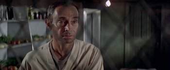 Movie still from “Soylent Green” (1973), directed by Richard Fleischer – A person wearing a white shirt; Close Up shot, Low angle