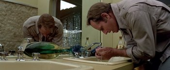 Movie still from “Soylent Green” (1973), directed by Richard Fleischer – A man washing his hands in a bathroom sink; Close Up shot, Low angle