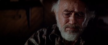 Movie still from “Soylent Green” (1973), directed by Richard Fleischer – An older man with a beard and a mustache; Close Up shot, Low angle