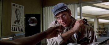 Movie still from “Soylent Green” (1973), directed by Richard Fleischer – A person wearing a hat; Close Up shot, Over the shoulder angle