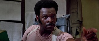 Movie still from “Soylent Green” (1973), directed by Richard Fleischer – A person wearing a shirt; Close Up shot, Low angle