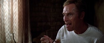 Movie still from “Soylent Green” (1973), directed by Richard Fleischer – A person holding a fork; Close Up shot, Low angle