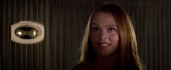 Movie still from “Soylent Green” (1973), directed by Richard Fleischer – A person with long brown hair; Close Up shot, Over the shoulder angle