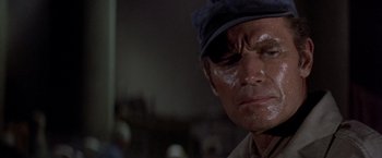 Movie still from “Soylent Green” (1973), directed by Richard Fleischer – A person with a hat on; Close Up shot, High angle