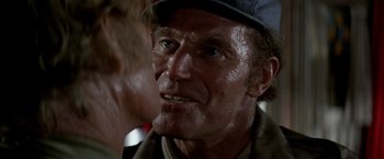 Movie still from “Soylent Green” (1973), directed by Richard Fleischer – An older man with a hat on looking into a mirror; Close Up shot, Over the shoulder angle