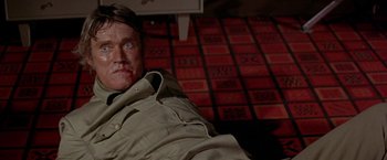 Movie still from “Soylent Green” (1973), directed by Richard Fleischer – A person laying on the ground; Close Up shot, High angle