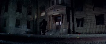 Movie still from “Soylent Green” (1973), directed by Richard Fleischer – A man walking down the steps of a building; Extreme Wide shot, Low angle