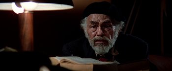 Movie still from “Soylent Green” (1973), directed by Richard Fleischer – An old man with a beard wearing a black hat; Close Up shot, High angle