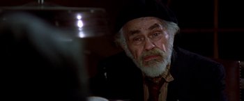 Movie still from “Soylent Green” (1973), directed by Richard Fleischer – An older man with a beard and a hat; Close Up shot, High angle