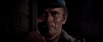Movie still from “Soylent Green” (1973), directed by Richard Fleischer – A person holding a cell phone; Close Up shot, High angle