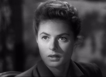 Movie still from “Spellbound” (1945), directed by Alfred Hitchcock – A black - and - white photo of a woman's face; Close Up shot, Over the shoulder angle