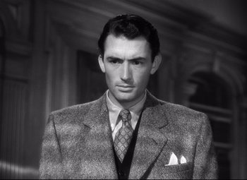 Movie still from “Spellbound” (1945), directed by Alfred Hitchcock – A black and white photo of a man wearing a suit; Close Up shot, Over the shoulder angle